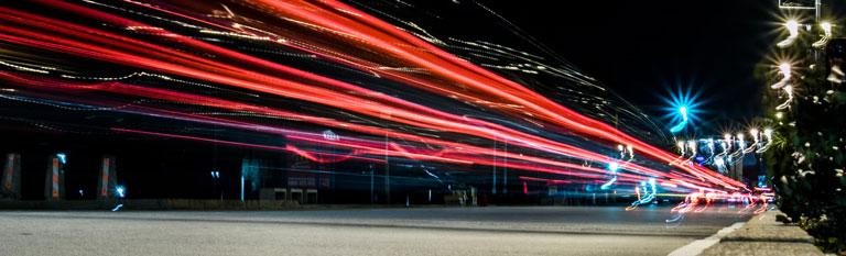 night image of car lights steaming by